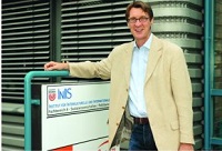 Prof. Dr. Probst in front of the former entrance of the InIIS